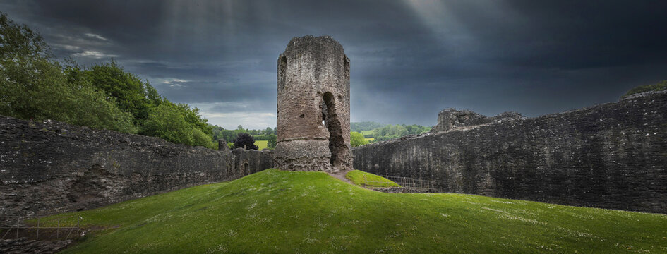 Ruins of the Monmouthshire, Skenfrith castle England. Panorama. Dark clouds. 