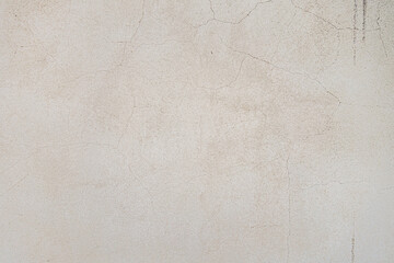 abstract background of an old shabby painted white wall close up