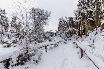 Winter view of a path in Prachovske skaly rocks in Cesky raj (Czech Paradise) region, Czech Republic