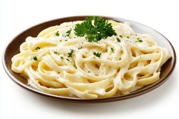 A plate of creamy fettuccine pasta garnished with parsley.