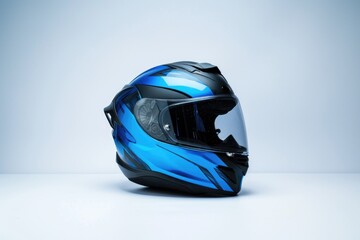 Fototapeta premium A blue and black helmet sits on a white surface