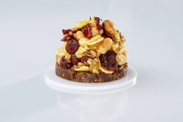 Small sweet dessert with chocolate and almonds isolated against white background