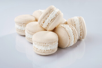 Close up view. Bunch of macarons on the white surface