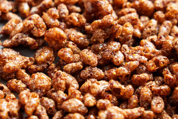 Sweet chocolate corn rice flakes with gluten-free ingredients close up. Organic brown crispy grains. Healthy morning breakfast