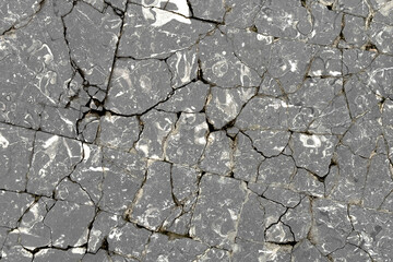 Broken cracked granite exterior block floor as abstract gray background close up