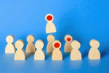 Wooden blocks with people icon on blue background Wooden blocks with people icon on blue background