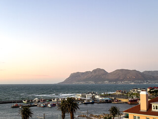 Fototapeta premium A view of Kalk Bay Harbour in Cape Town South Africa. It lies on the west coast of False Bay