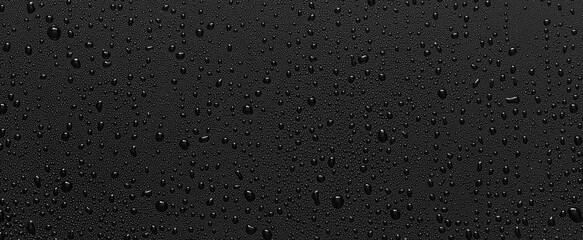 Water drops on abstract black background.