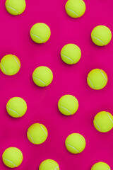 Studio, collection and tennis ball in closeup for sports, competition and cardiovascular exercise. Above, equipment and softball in pink background for bounce, game and fitness for cardio wellness