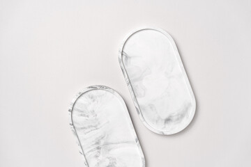 Cosmetics Product Presentation Flat Lay Scene made with Two Marble Oval Trays