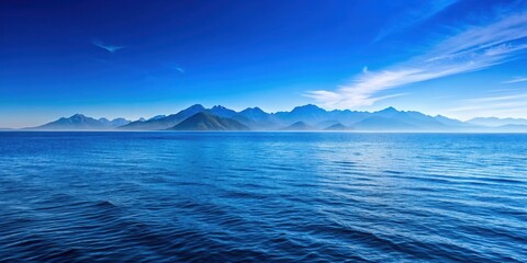 Fototapeta premium Blue ocean with mountains in the background, blue, ocean, mountains, landscape, nature, peaceful, serene, tranquil, scenic, horizon
