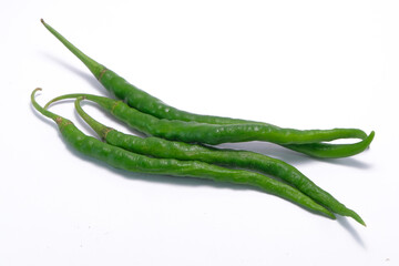 long green chilies on a white background