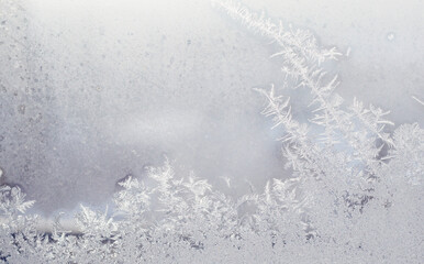 Frosty winter pattern on glass