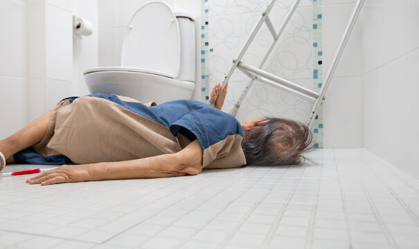 Elderly woman falling in bathroom because slippery surfaces.