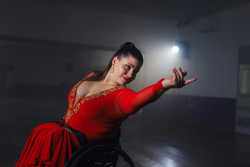 Beautiful dance in a wheelchair of a woman with disability at a dancing studio. Para dance sport. © 24K-Production