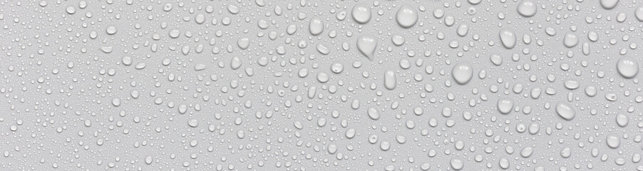 Water drops on abstract gray background.