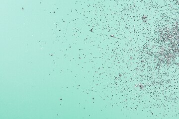Naklejka premium Chipped paint on light green textured surface with scattered flakes and rough details Generative AI
