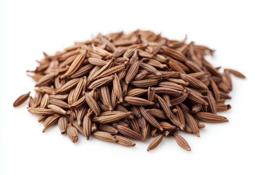 A pile of brown cumin seeds on a white background.