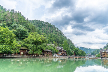 Fototapeta premium Traditional Miao Architecture and Mountainous Scenery in Fenghuang Ancient Town, Hunan Xiangxi