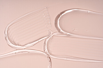 Smears of gel texture on beige background