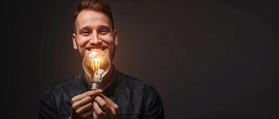 The Brilliant Mind: A Smiling Man Holding a Light Bulb