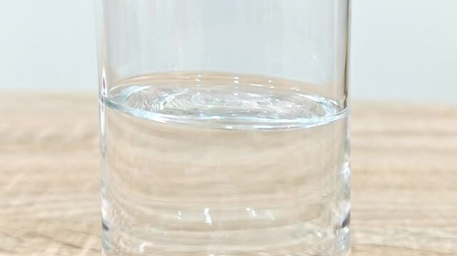 Water in the glass is shaking.