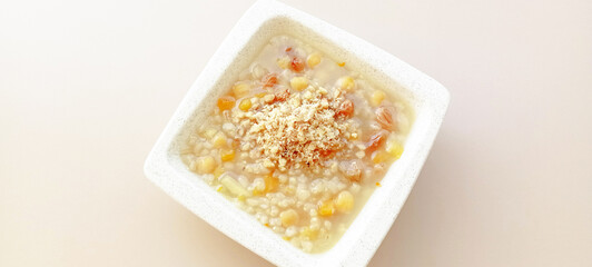 Ashura or Ashura dessert made with legumes and dried fruits on a white background