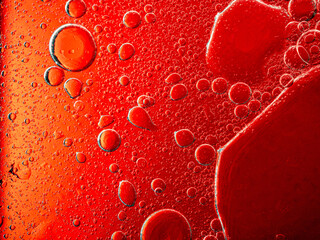 Abstract Background Red oil Macro Colorful artistic of oil drop floating on the water. macro red bubble oil of wallpeper, blood concept