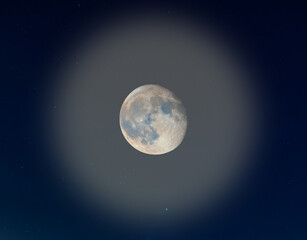 Full moon in the blue sky
