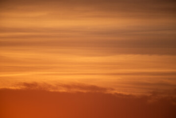 Photography of a Reddish sky with clouds at dusk