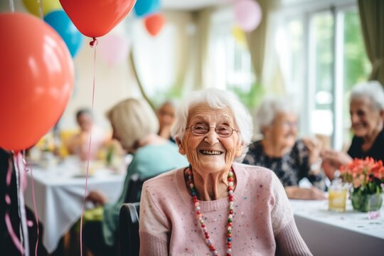 Portrait of smiling diverse seniors celebrating birthday in nursing home - Powered by Adobe