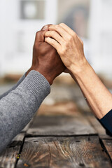 Holding hands, kindness and support of people, table and empathy of love with respect, care and...