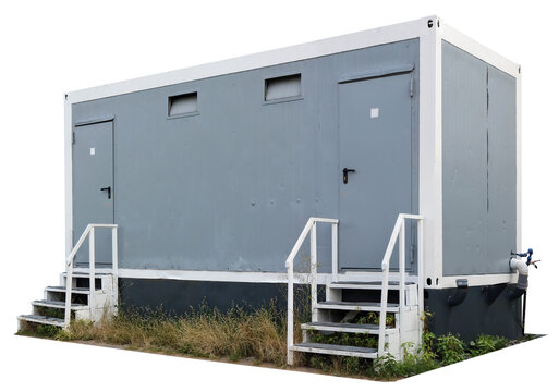 A public toilet  in a city park is made from a shipping container isolated