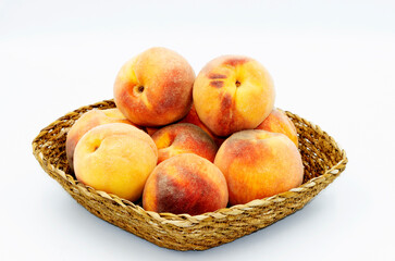 Peach, one of the most beautiful fruits of the summer season with its taste and smell, in a basket