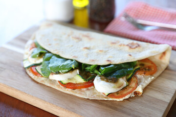 Italian cuisine , Piadina with tomatoes and cheese