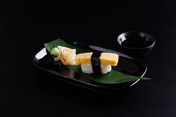 Tamago sushi egg sushi Japanese food Japanese seafood isolated in black background