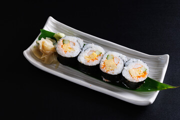 Futomaki sushi rolls Japanese food isolate in black background