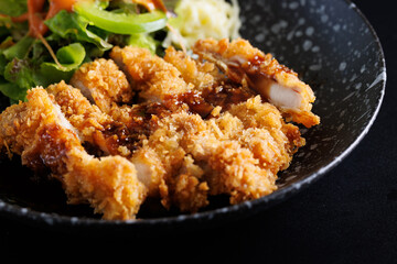Tonkatsu Traditional Japanese food, Deep Fried Pork Cutlet isolate in black background
