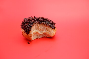 bite marks on donuts with chocolate sprinkles