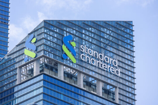 Standard Chartered logo at the roof of the building in Singapore