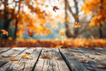 Autumn background. Wooden empty boards table against the backdrop of an autumn park with colorful falling leaves, beautiful bokeh with sunset lighting