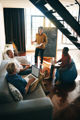 Creative, woman and team at blackboard presentation for startup, brainstorming or growth workshop....