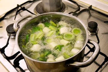 boiling water with leek pieces