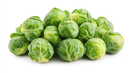 Fototapeta premium A pile of fresh Brussels sprouts on a white background.