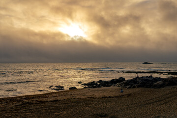 Sunset on the beach in Porto city, Portugal. Vertical shot