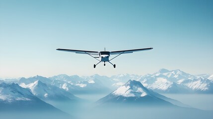 A small plane flying over a mountain range