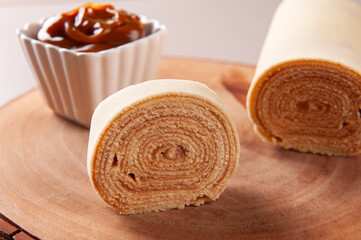 Typical dessert from northeastern Brazil called Bolo de Rolo. Stuffed with dulce de leche or guava paste. Selective focus
