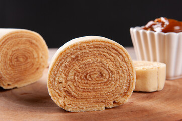 Typical dessert from northeastern Brazil called Bolo de Rolo. Stuffed with dulce de leche or guava paste. Selective focus
