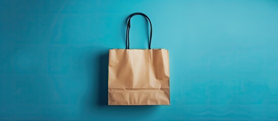 Shopping bag on a blue background viewed from above Shopping Black Friday seasonal sale in store shopping theme Copy space