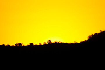 Golden sunrise over the mountain. Beautiful sunset